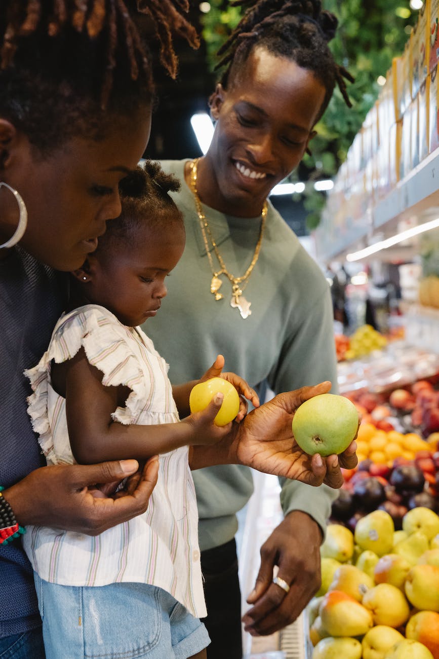 a family buying groceries in a supermarket. Showing how it feels to shop in Shopafrikhub, the African Grocery Store